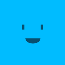 A blue square has a smile, which is composed of two short rectangles and a semicircle.