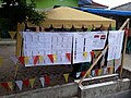 List of presidential and legislative candidates displayed outside a polling station