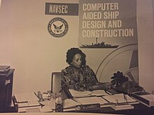 photograph of Raye Montague working at her desk