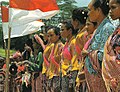 Image 29Timorese women with the Indonesian national flag (from History of Indonesia)