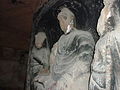 A damaged statue of the Buddha