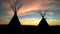 Sunset with tepees on the Wind River Indian Reservation in Wyoming.