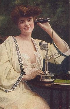 An early 20th-century candlestick telephone in use