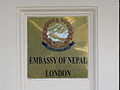 Plaque outside the embassy depicting the Emblem of Nepal