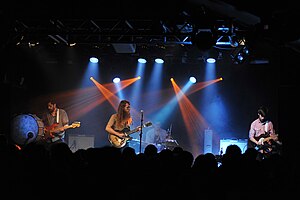 Maps & Atlases performing in 2012. Left to right: bassist Shiraz Dada, guitarist/vocalist Dave Davison, drummer Chris Hainey and former guitarist Erin Elders.