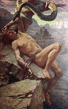 A man, tied to a cliff, cowers at a snake menacing at him from inches away.