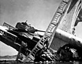 Wrecked North Korean tank on bridge near Pyeongtaek during the Korean War.