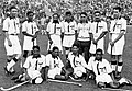 Indian hockey team, captained by Dhyan Chand (standing second from left), after winning the finals at the 1936 Summer Olympics – their third of six consecutive Olympic golds.