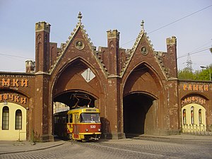 A Tatra T4 under the Brandenburg Gate, before 2012 when restoration work started on The Gate