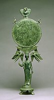 Fancy Early Classical bronze mirror with human caryatid handle, c. 460 BC