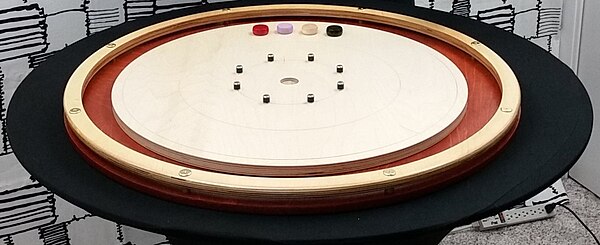 The round version of pichenotte aka crokinole