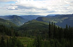 View over Begnadalen from Lærskogen, with the large woodland ranging all over to Randsfjorden on the left and Hedalsfjella in the right background.