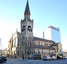 A Romanesque Revival cathedral with two spires of unequal height