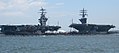 Two aircraft carriers docked in Norfolk harbor