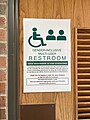 Gender-inclusive multi-user restroom sign at Hamline University