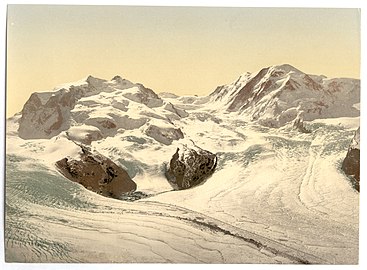 Around 1890–1900 (photomechanical print): The upper Gorner Glacier (left) is still the main tributary of the lower part; the old Monte Rosa Hut (built 1894–95) would have been found just few metres above the north-eastern border of the Grenzgletscher (in the middle; compare with the third picture).