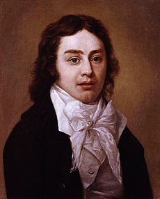 Half-length portrait of a man wearing a black jacket and white shirt with an elaborate white bow at the neck. He has wavy, medium-length brown hair.