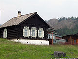 A wooden house in Bolshiye Koty, representative of typical style with ornate windows