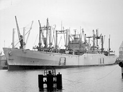 USNS Comet moored pierside at Bremerhaven, Germany, April 1976.