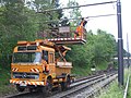 Road-rail vehicle with elevated platform for installing catenary