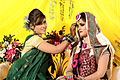 Image 33Relatives decorating the bride with traditional wedding turmeric in a Bangladeshi Gaye Holud ceremony in Dhaka. (from Culture of Bangladesh)