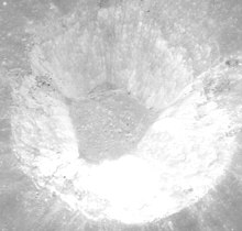 Interior of Petit, showing flat crater floor of impact melt with no visible craters, from Apollo 17