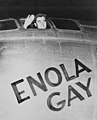 Colonel Paul Tibbets, pilot of the Enola Gay, waving from its cockpit