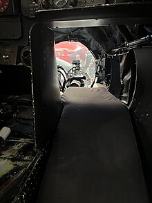 Interior shot of the bomber's position, showing a mattress that allows the crew member to lay comfortably as well as the glass dome in front, through which the crew member would control the plane during bombing.
