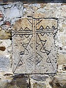 Morsleben Stone 2. A stylised cross intersecting an X. Triangular decorations are suggestive of the tree of life.