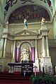 Latin on altar and wall of cathedral in USA. Understood by few, but seen as holier by some.