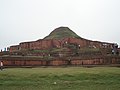Image 34alt=Ruins of a structure of red stone now resembling a small hill or mound. (from Culture of Bangladesh)