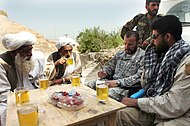 Village elders and US special forces drinking Afghan green tea (kawa) in 2007