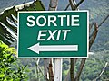 An exit sign in Mauritius in French and English