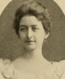 A young white woman with hair in a bouffant updo, in an oval frame