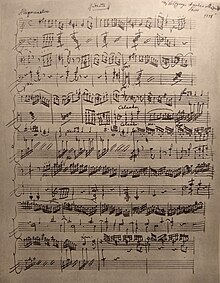 An old page of handwritten piano music.