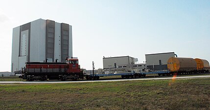 An SW1500 hauls NASA equipment cars along the NASA Railroad in Cape Canaveral, Florida.