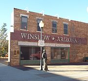Standing on the Corner in Winslow Arizona. The verse which cites the corner was made famous by the Eagles 1972 hit song "Take It Easy". The corner and statue are located in the intersection of Second and Kinsley Streets.