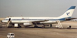 A lengthwise photo of an Airbus A300 aircraft in white and blue Iran Air livery