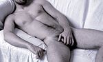 Nude male model, using the male equivalent of the handbra, 2009