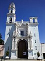 Church of Los Remedios in Puebla, Mexico, with a bell-gable to the right and a belltower to the left.