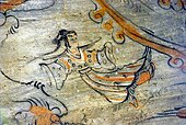 Person flying in skies in tomb painting, an apsara?