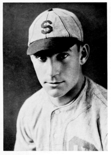 A man in a white baseball jersey and cap with a "S" on the front.