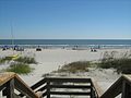 View of the beach from end of wooden boardwalk at Disney's Beach House