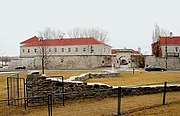 Remnants of the old fort with the new Fort Frontenac in background