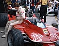 Gilles Villeneuve sitting beside the Ferrari 312T at the 1979 San Marino Grand Prix. Just like in previous seasons, the Scuderia Ferrari livery included Goodyear and Agip as their sponsors