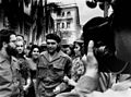 Alberto Korda taking a picture of Che Guevara, with arms linked to his wife Aleida March.