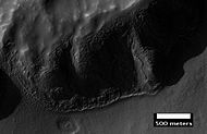 Layers in mantle deposit, as seen by HiRISE, under the HiWish program. Mantle was probably formed from snow and dust falling during a different climate. Location is Thaumasia quadrangle