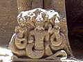 A motif of a snake goddess. Carving on volcanic rock at the Kailash Temple, Ellora, India