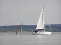 A yacht entering the river from the Solent