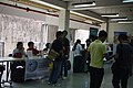 Butch Bustria and Jojit Ballesteros of Wikimedia Philippines at the booth at the TIP CITE week with some visitors